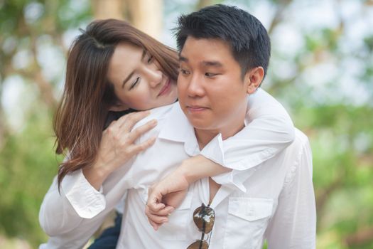 Happy young asian couple in love outdoor