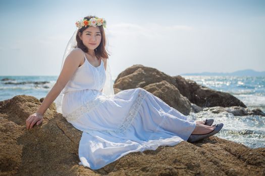 Beautiful asian young woman on the beach