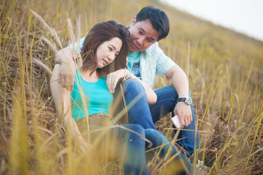 Happy young asian couple in love outdoor