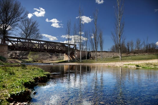 Natural landscape. Beautiful river landscape with railway bridge in background