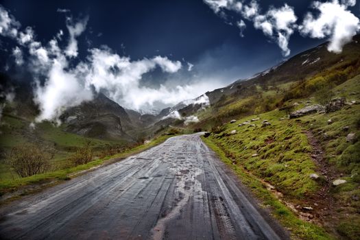 
beautiful mountain landscape with wet road