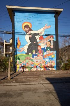 Colourful murals adorning the walls of tenement blocks in the San Miguel area of Santiago, capital of Chile. The area was created as an open air museum in what was a run down area of the city.