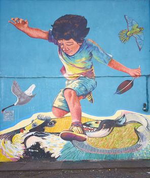 Colourful murals adorning the walls of tenement blocks in the San Miguel area of Santiago, capital of Chile. The area was created as an open air museum in what was a run down area of the city.