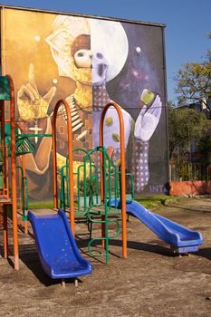 Colourful murals adorning the walls of tenement blocks in the San Miguel area of Santiago, capital of Chile. The area was created as an open air museum in what was a run down area of the city.