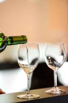 Tasting-White wine pour in a glass