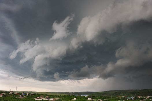 Beginning of the storm, cold weather front covers the village. Panorama stitched from 4 mages.