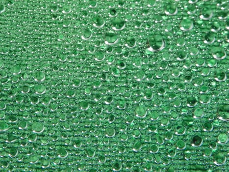 Water drops green background