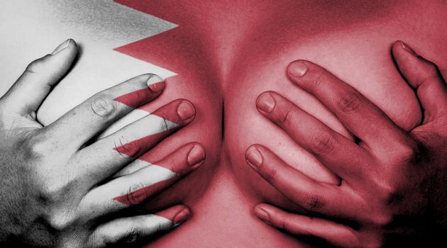 Upper part of female body, hands covering breasts, Bahrain
