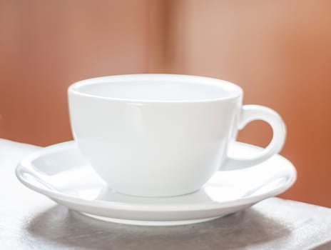 Cup of coffee on a wooden table, stock photo