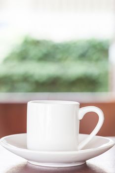 White cup on table in Coffee shop, stock photo