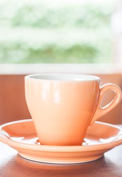 Orange cup of coffee with espresso shot, stock photo