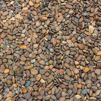 Pile of round peeble stones for background