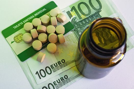 tablets and pill bottle, concept of pharmaceutical copayment