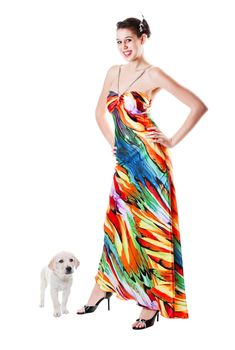 Young woman, dressed and ready for prom, smiles as her Labrador Retriever puppy decides to become part of the picture!