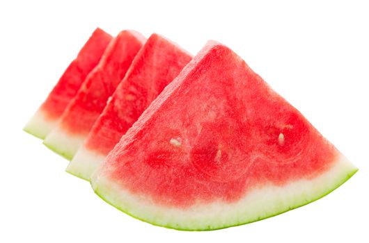 Four ripe, juicy, watermelon wedges.  Shallow depth of field.  Shot on white background.