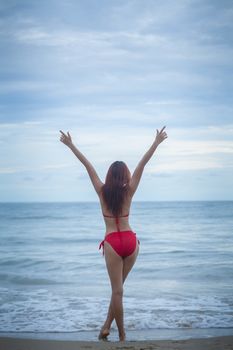 Young beautiful asian woman posing at beach