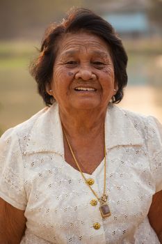 Portrait Of Happy Senior Asian Woman At Outdoor