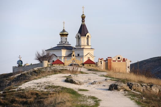 Christian Orthodox church in Old Orhei, Moldova, in rays of sunset