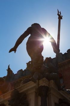 Silhouette of Fountain of Neptune, monumental civic fountain located in the eponymous square Piazza Nettuno next to Piazza Maggiore in Bologna, Italy.