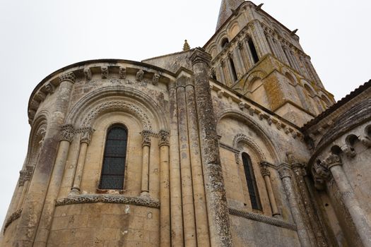 Close-up abse and tower view of Aulnay de Saintonge church in Charente Maritime region of France