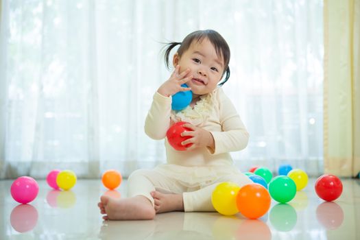 Portrait of little asian girl in home