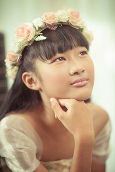 Portrait of a beautiful asian girl with flower crown