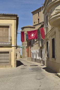 Street decorated with flags for the Feast of Corpus Christi in Oropesa, a Spanish town in the province of Toledo.