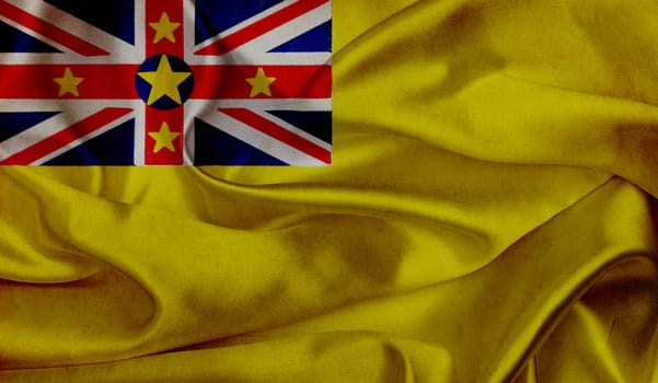 Niue grunge waving flag