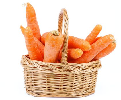 Bunch of Fresh Raw Carrot in Wicker Basket isolated on white background