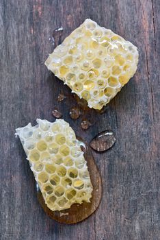 Honeycomb on a vintage wooden background