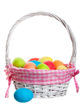An Easter Basket full of freshly dyed eggs. Shot on white background.