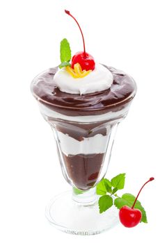 A layered chocolate parfait, garnished with whipped cream, cherries, lemon balm, and a delicate lemon curl.  Shot on white background.
