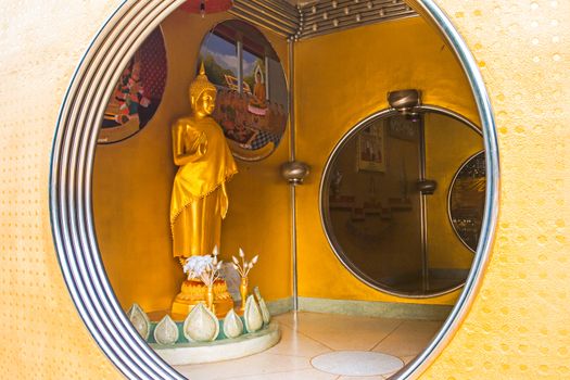 Golden Buddha Statue in the Circle at the stainless steel pagoda in Songkhla, Thailand