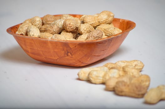 Peanuts in a brown bowl