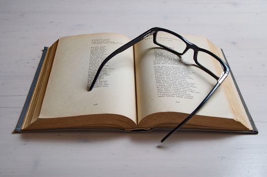 Reading glass on an old book