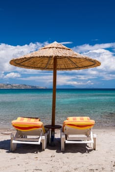 Chairs and umbrella on a beautiful beach.