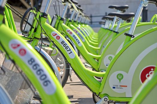 BUDAPEST, HUNGARY - JUNE 01 2014:Auckland waterfront bike hire.Many cities around the world have bicycle sharing systems or community bicycle programs.The first was the White Bicycle plan in Amsterdam in 1965.