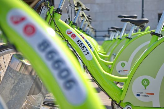 BUDAPEST, HUNGARY - JUNE 01 2014:Auckland waterfront bike hire.Many cities around the world have bicycle sharing systems or community bicycle programs.The first was the White Bicycle plan in Amsterdam in 1965.