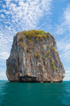 Beautiful tropical beach with big stones and blue sky