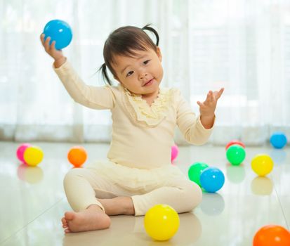 Portrait of little asian girl in home