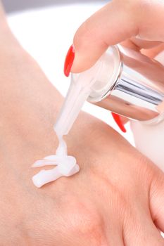 beauty salon, manicure and hands skin care - cream applying