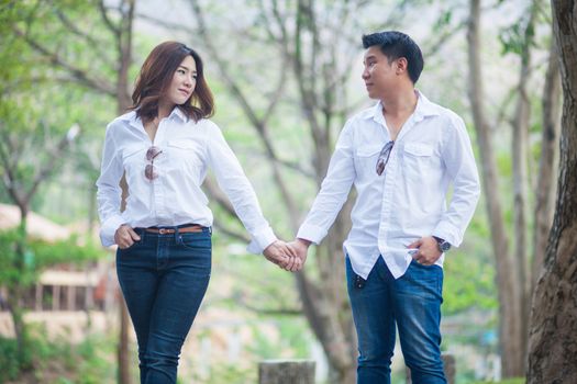 Happy young asian couple in love outdoor