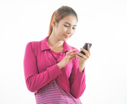 Beautiful smiling young woman holding a smart phone isolated on white background