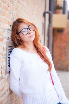 portrait of beautiful asian woman with stone wall