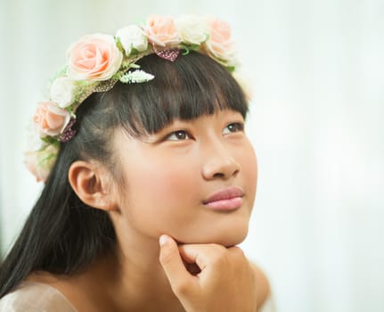 Portrait of a beautiful asian girl with flower crown