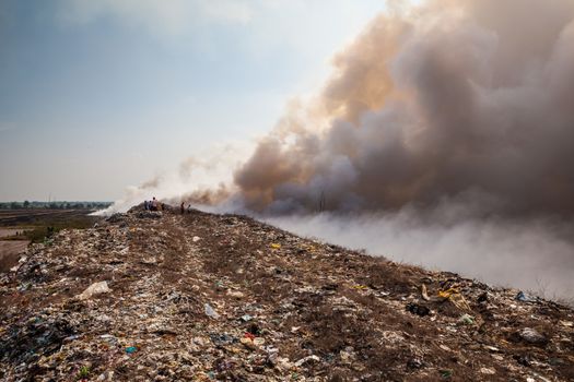 Burning garbage heap of smoke from a burning pile of garbage