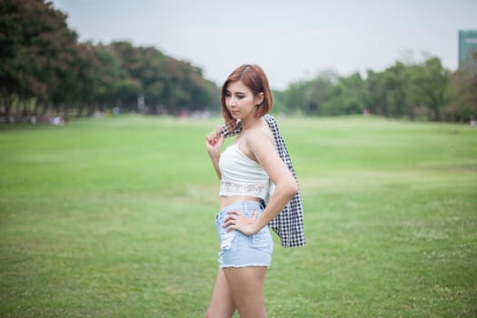 Portrait of beautiful asian woman in the park