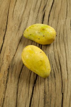 Mango fruit on a old wooden background