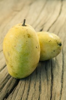 Mango fruit on a old wooden background