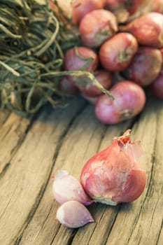 Organic garlic on the old wood background